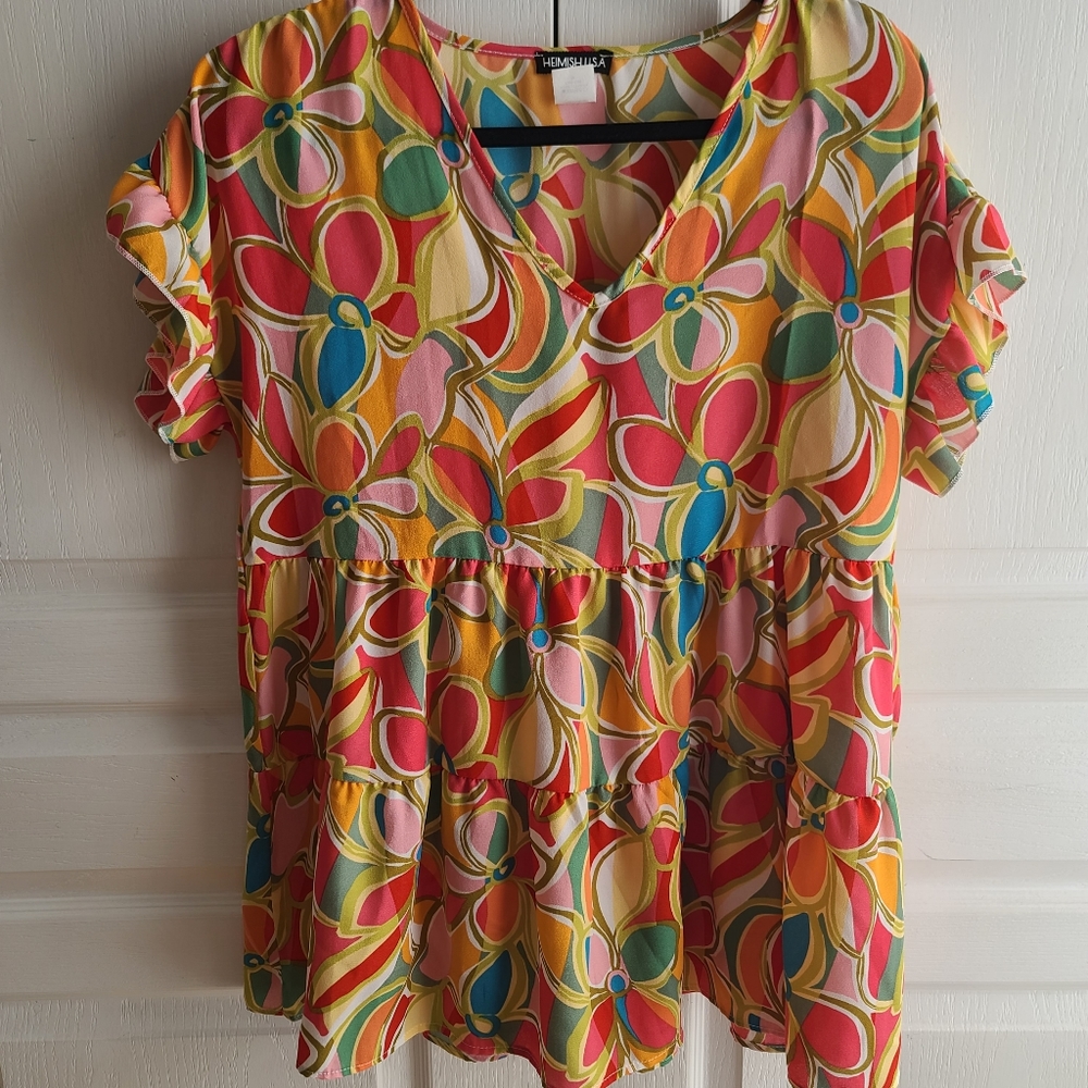 Loose fitting top new without tags. Never wore.
